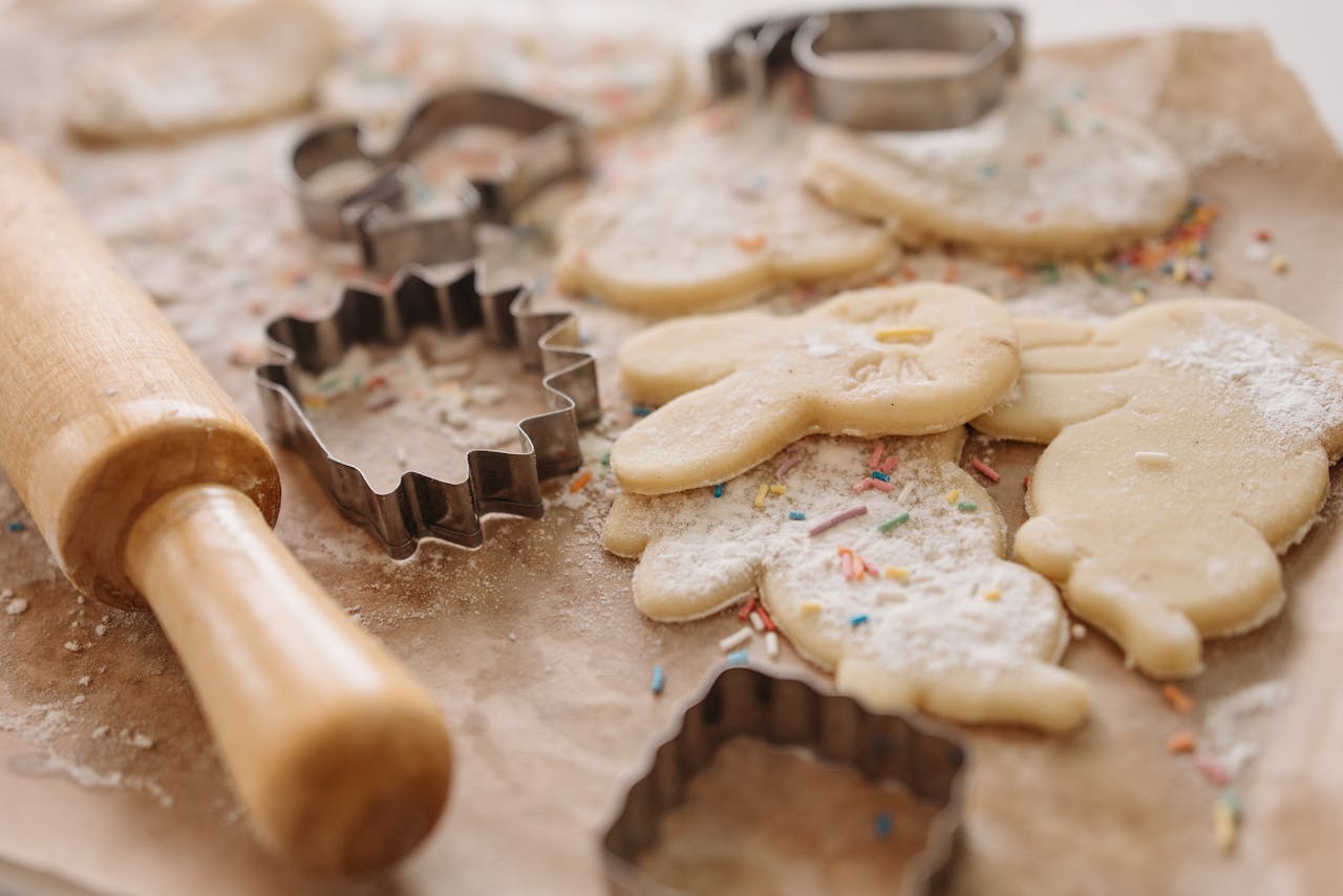 Delightful cookie baking session with shapes and sprinkles captured in close-up.